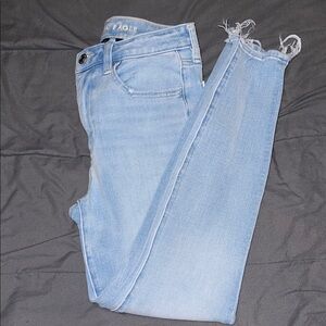 American Eagle Outfitters Light Blue Skinny Jeans with Raw Hem